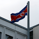 North Korea’s flag, with a red stripe and star for Communism.